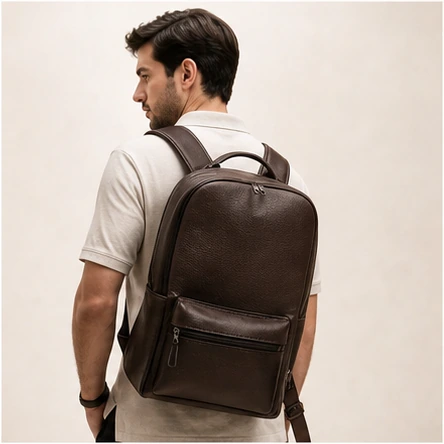 Man carrying a Highlark leather backpack
